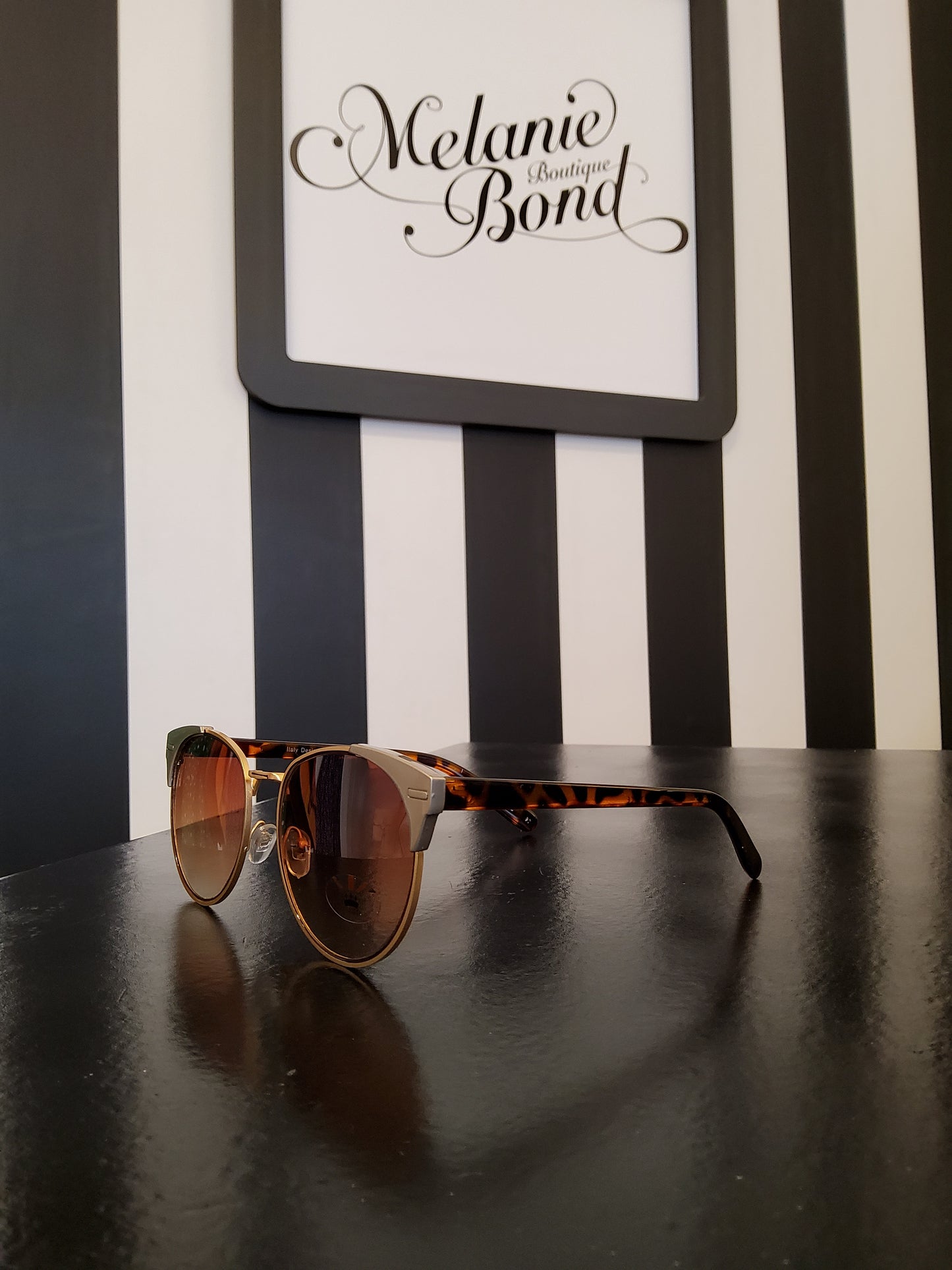 Gold rim tortoiseshell sunglasses