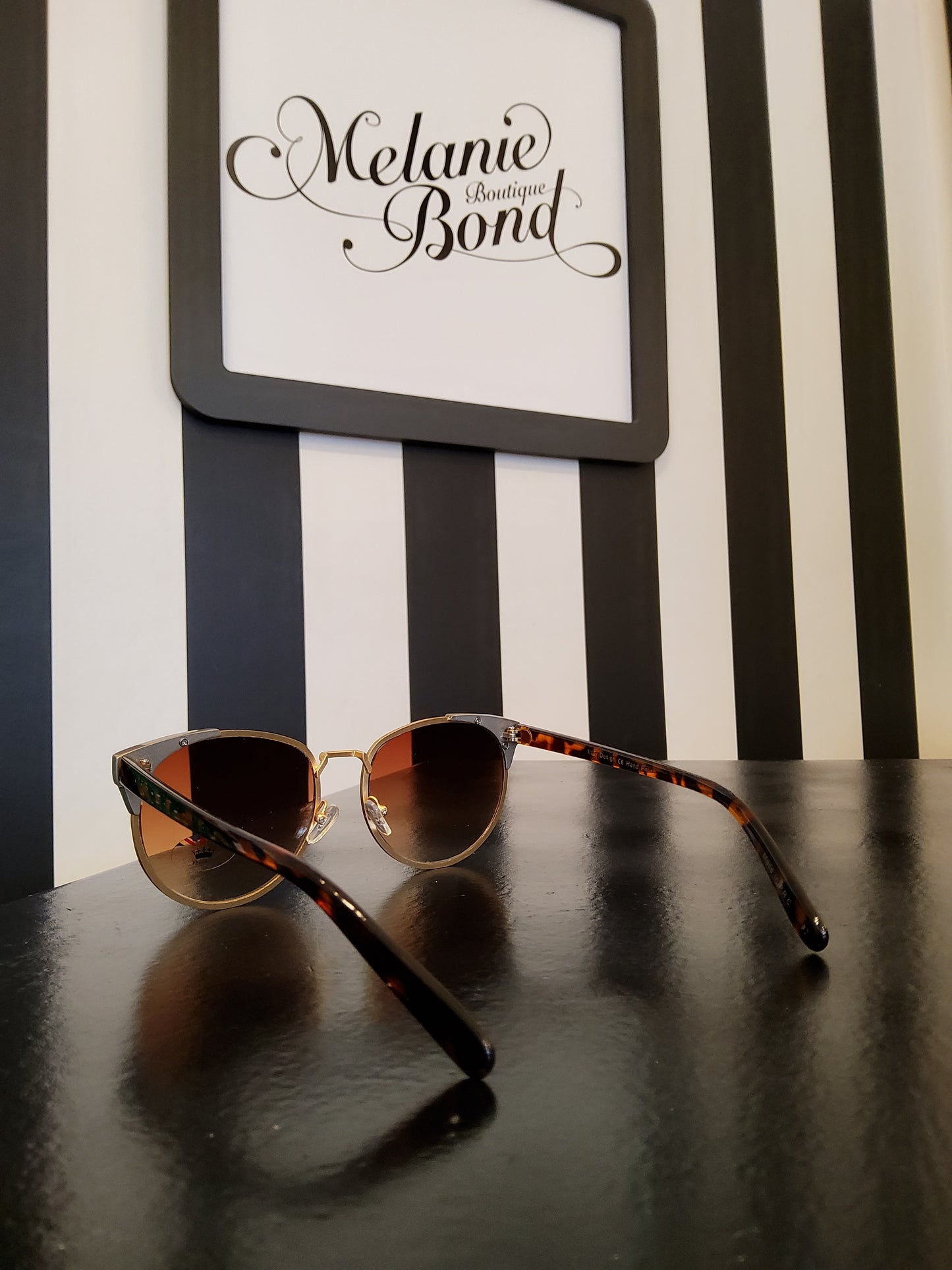 Gold rim tortoiseshell sunglasses