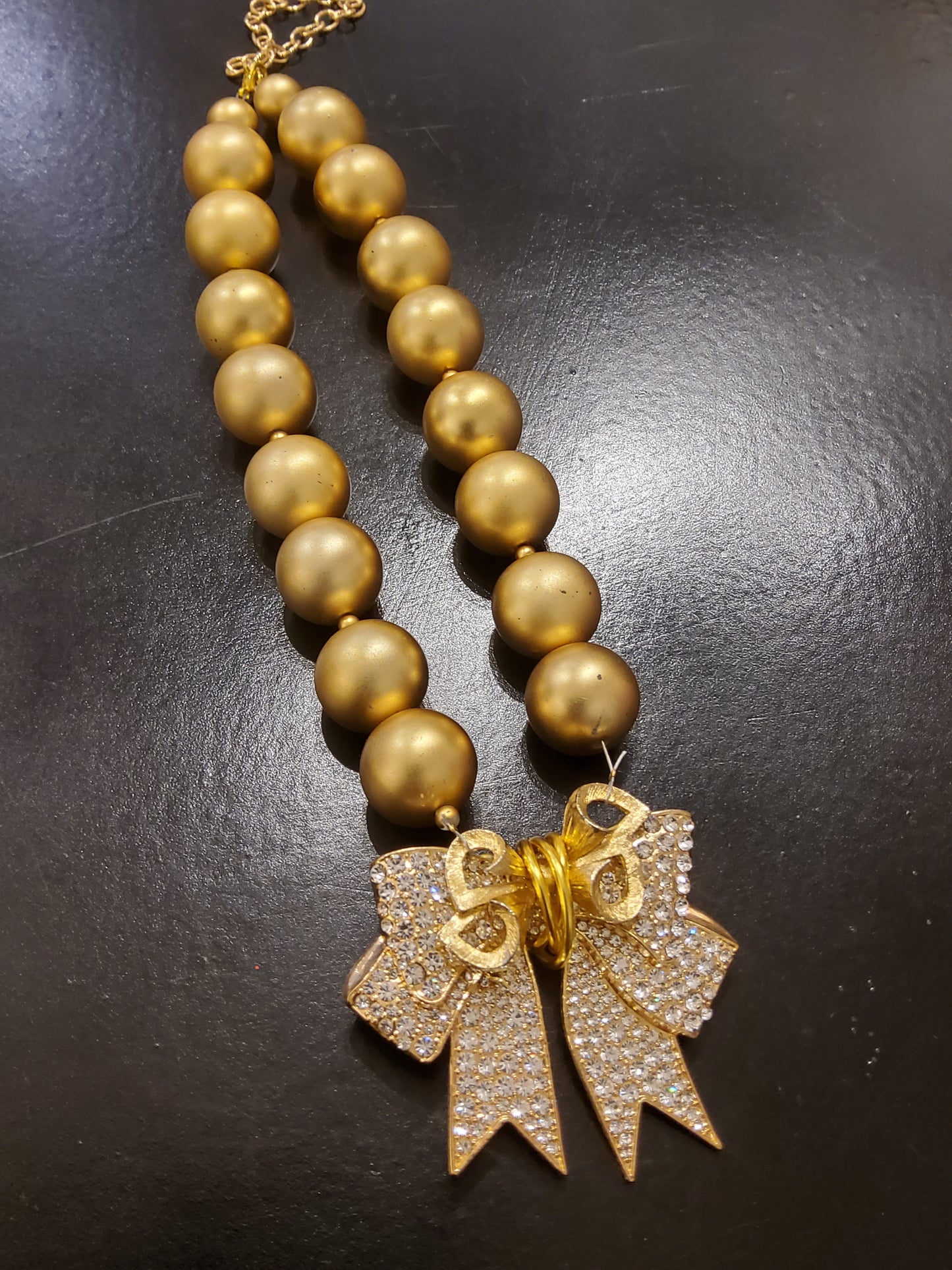 Diamanté Bow Chunky Gold Necklace