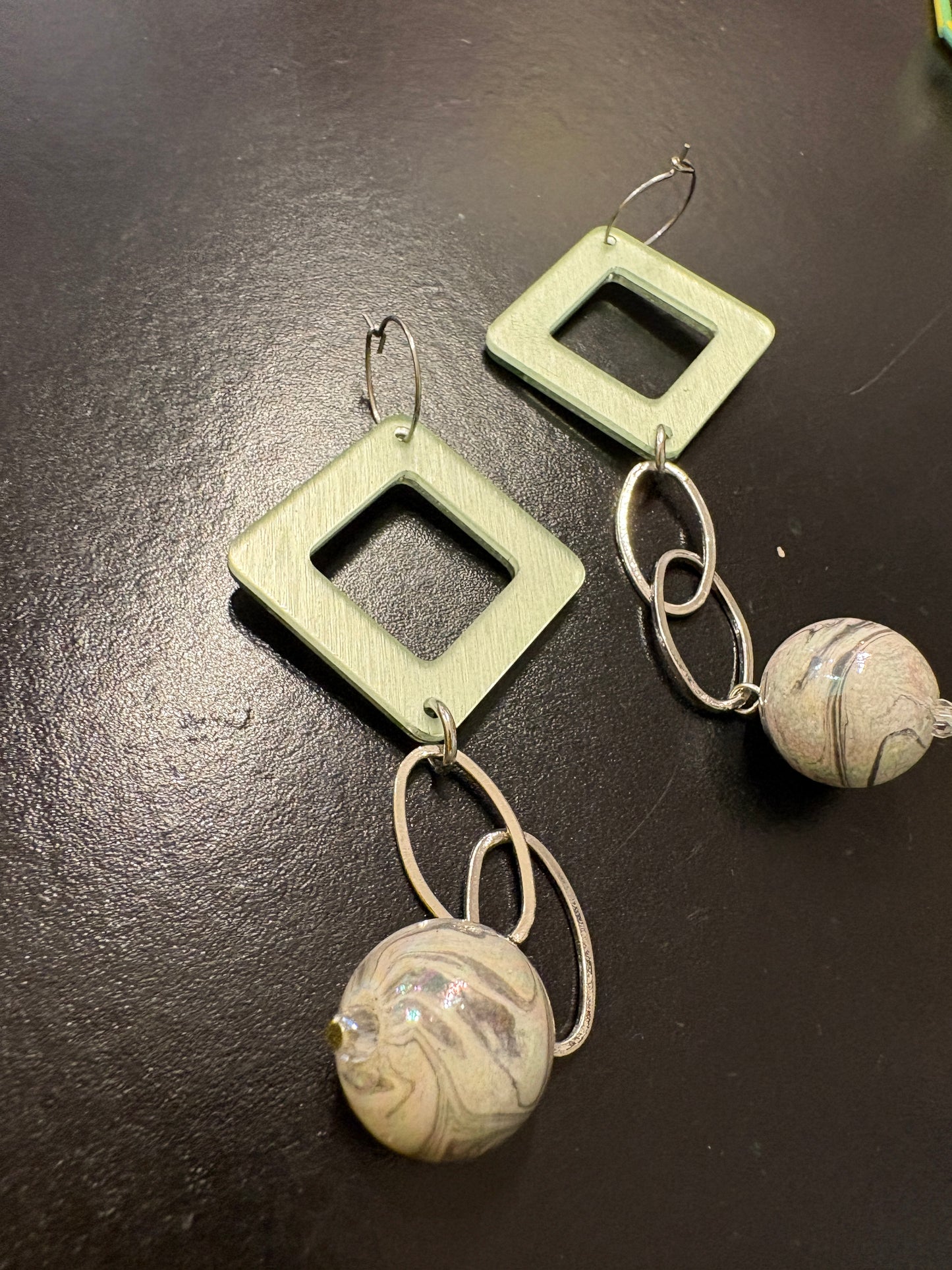 Geometric statement earrings in green, silver & grey