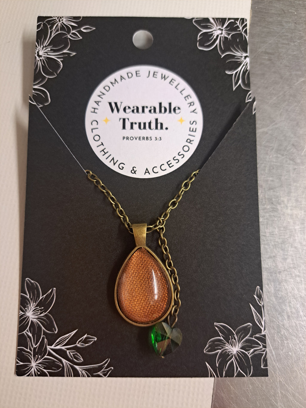 Terracotta linen teardrop with green crystal heart