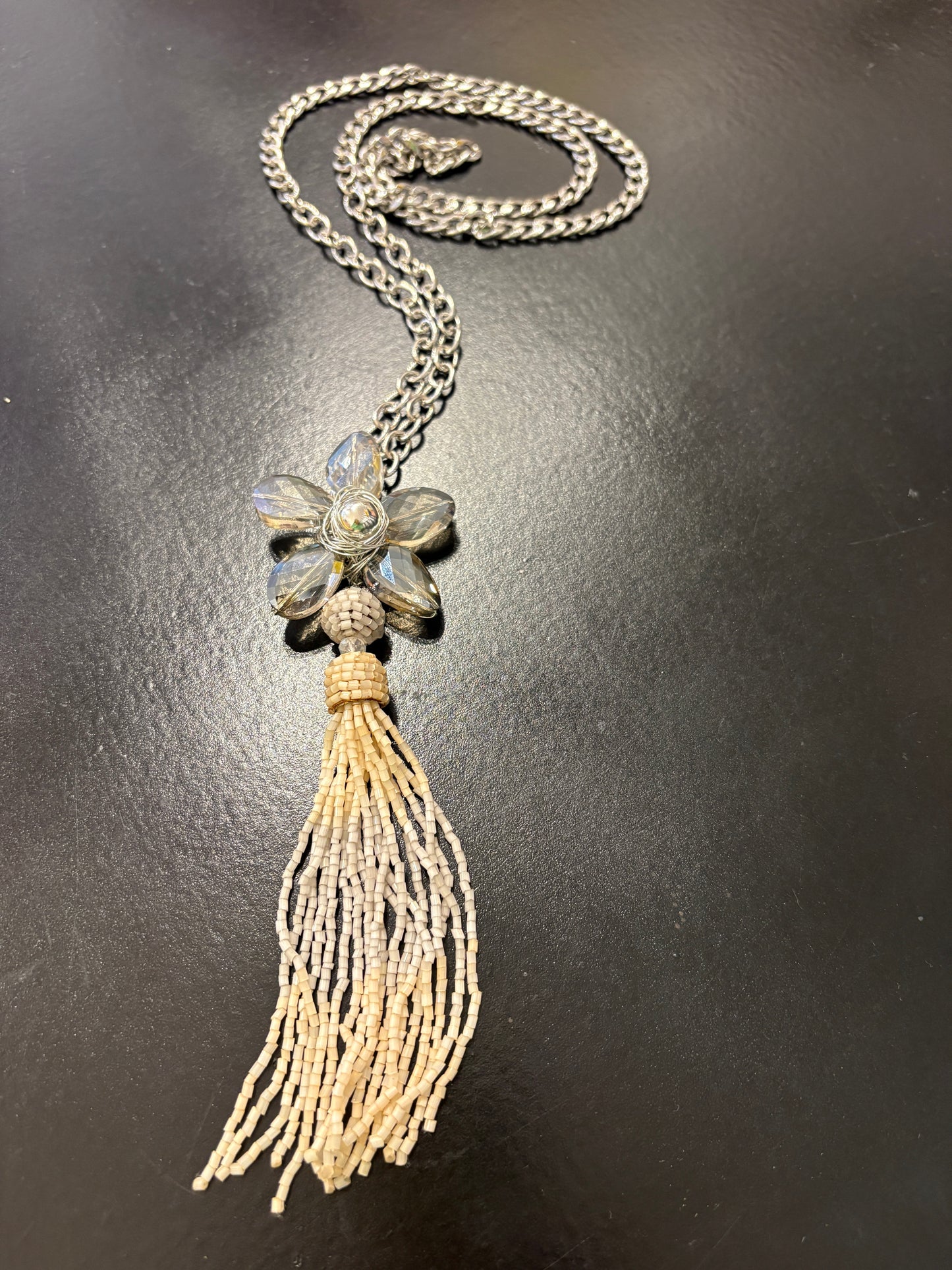 Grey crystal flower on long chain with beaded tassel detail