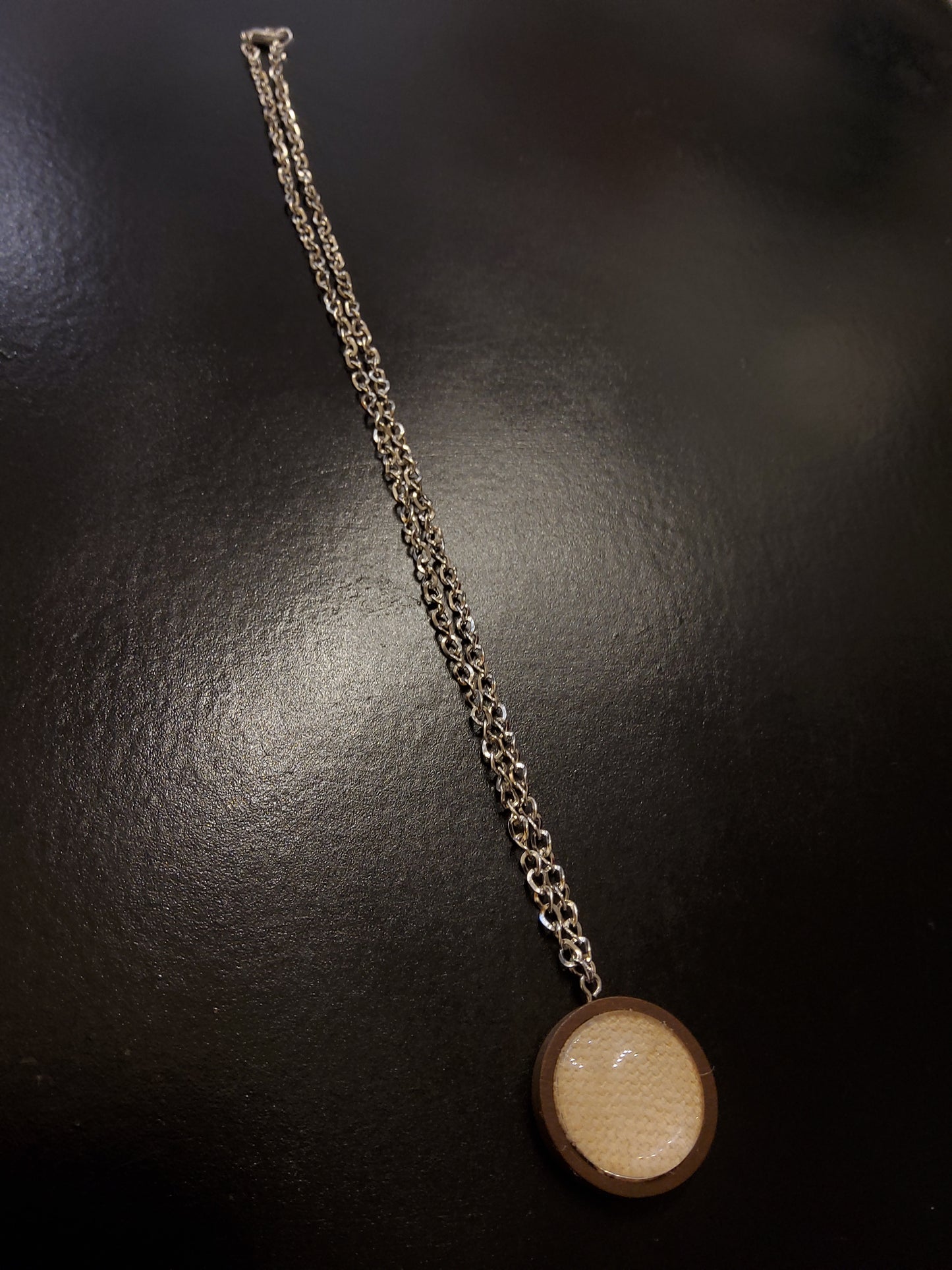 Cream Linen Necklace with silver chain and wooden base