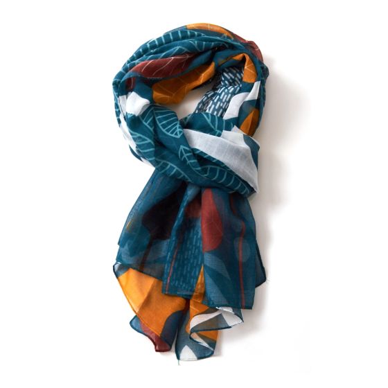 Teal leaf patterned scarf on a white background