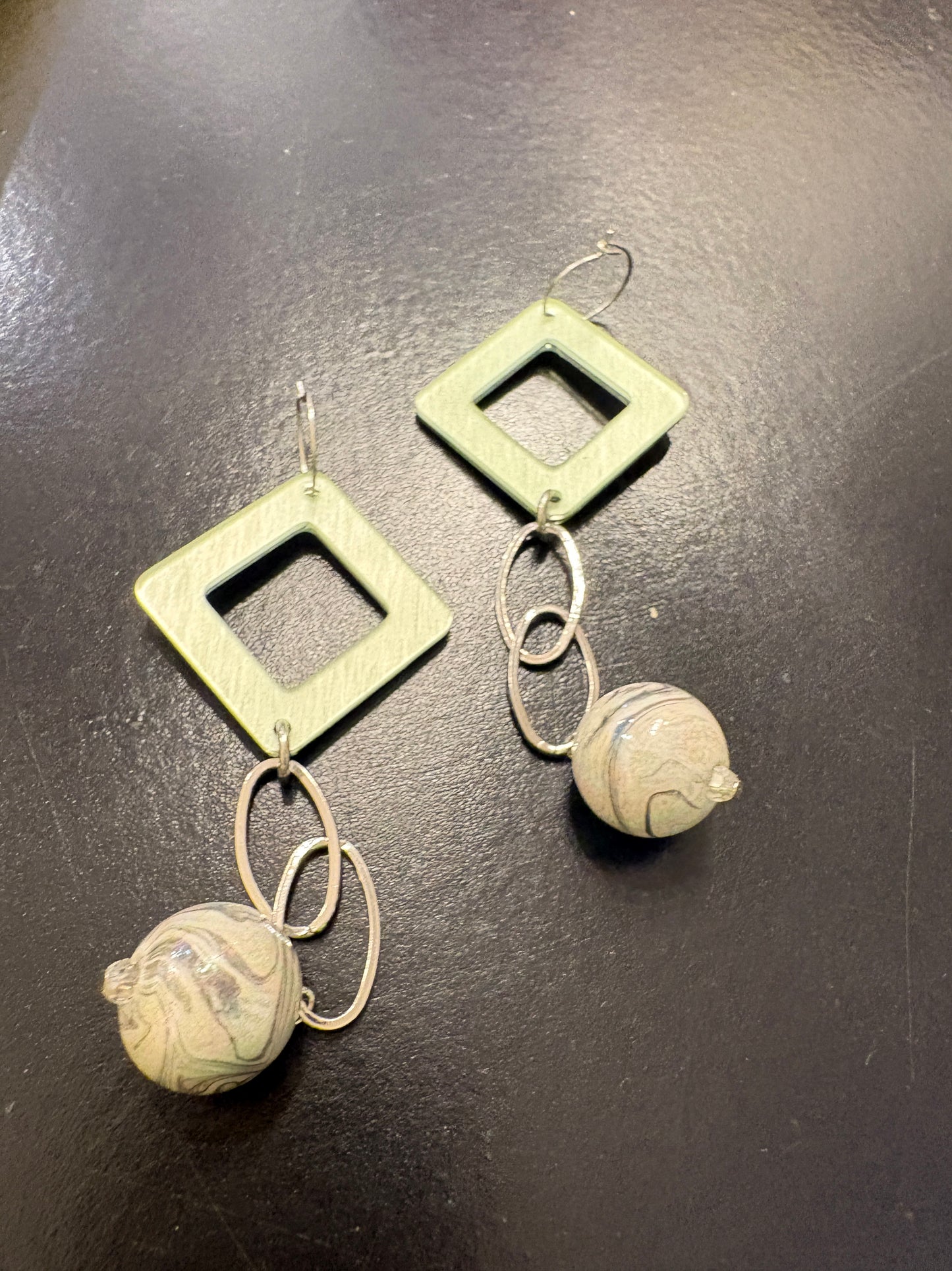 Geometric statement earrings in green, silver & grey