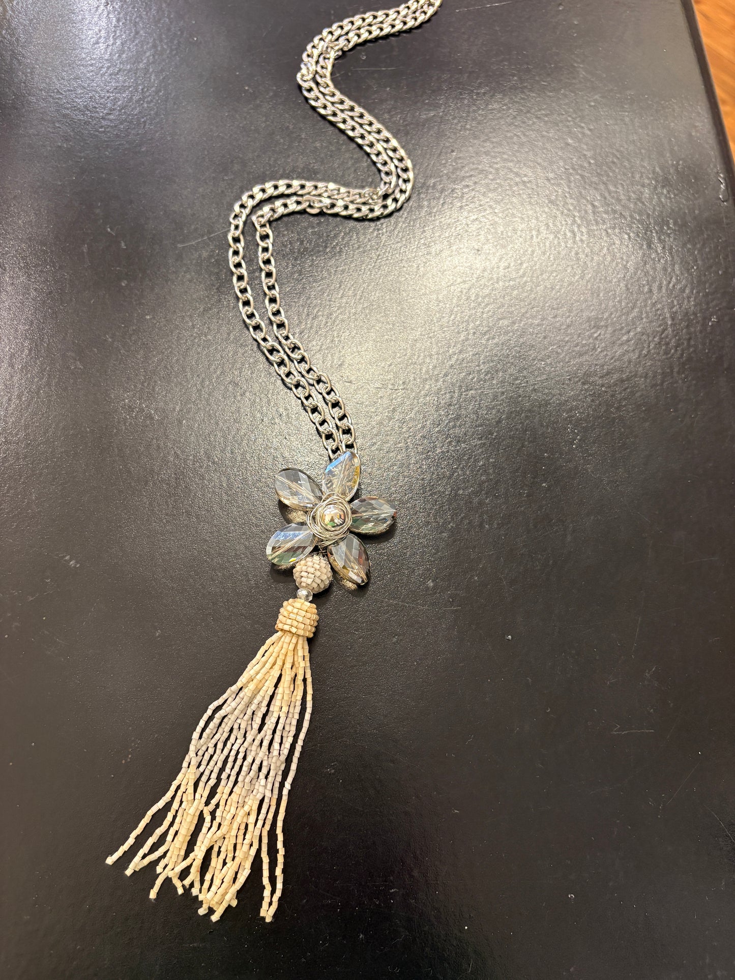 Grey crystal flower on long chain with beaded tassel detail